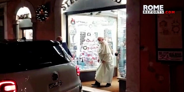 In this image from video made available by Javier Martinez Brocal of Rome Reports, Pope Francis leaves a record shop in Rome, Tuesday, Jan. 11, 2022.