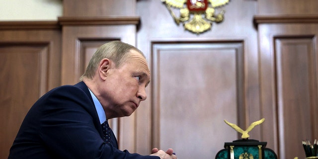 Russian President Vladimir Putin listens during a meeting in the Kremlin in Moscow, Russia, Monday, Jan. 17, 2022.