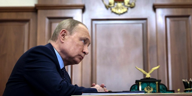 Russian President Vladimir Putin listens during a meeting in the Kremlin in Moscow, Russia, Monday, Jan. 17, 2022.