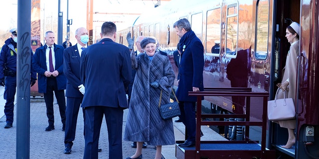 Queen Margrethe, Crown Prince Frederik and Crown Princes Mary arrive at Roskilde Station en route to Roskilde Cathedral on Queen Margrethe's 50th birthday at Christiansborg Castle, Copenhagen, Friday, January 14, 2022. 