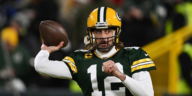 GREEN BAY, WISCONSIN - JANUARY 22:  Quarterback Aaron Rodgers #12 of the Green Bay Packers warms up prior to the NFC Divisional Playoff game against the San Francisco 49ers at Lambeau Field on January 22, 2022 in Green Bay, Wisconsin. (Photo by Quinn Harris/Getty Images)