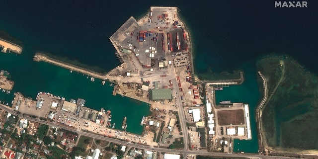 This satellite image provided by Maxar Technologies shows the main port facilities in Nuku’alofa, Tonga, on Dec. 29, 2021. 