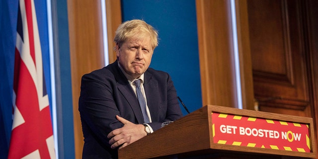 Britain's Prime Minister Boris Johnson pauses during a coronavirus media briefing in Downing Street, London, Tuesday, Jan. 4, 2022. 