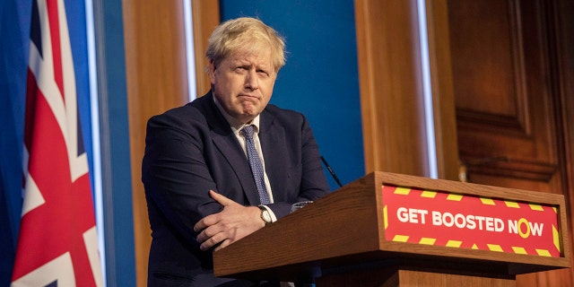 Britain's Prime Minister Boris Johnson pauses during a coronavirus media briefing in Downing Street, London, Tuesday, Jan. 4, 2022.