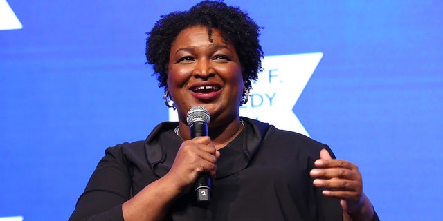 NEW YORK, NEW YORK - DECEMBER 09: Stacey Abrams speaks onstage during the 2021 Robert F. Kennedy Human Rights Ripple of Hope Award Gala on December 09, 2021 in New York City. (Photo by Monica Schipper/Getty Images for Robert F. Kennedy Human Rights)