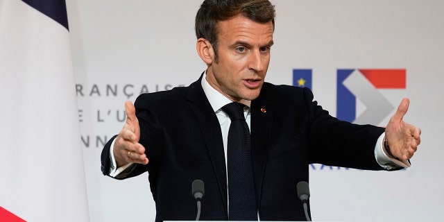 French President Emmanuel Macron speaks as he participates in a media conference with European Commission President Ursula von der Leyen after a meeting at the Elysee Palace in Paris, France, Friday, Jan. 7, 2022.
