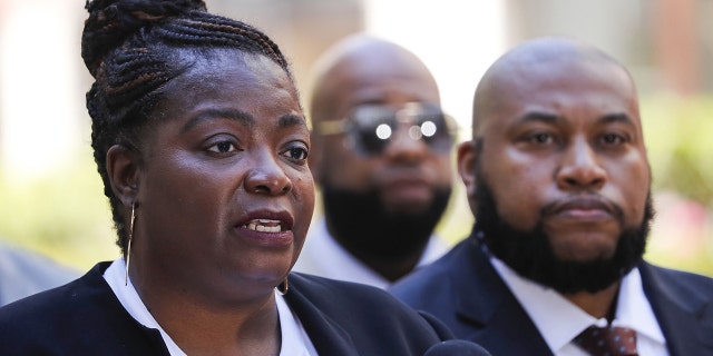 Anjanette Young, left, and attorney Keenan Saulter speak out in June on their efforts to resolve her case against the city of Chicago. That effort took six more months, with the City Council approving a settlement on Wednesday, Dec. 15, 2021.