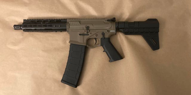 The NYPD found this loaded AR-15 under Lashawn McNeil's mattress the day after he allegedly shot two officers, leaving one dead and the other critically wounded.