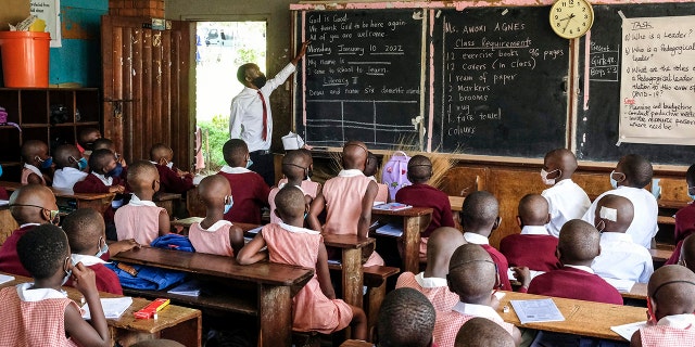 Students wear face masks when attending classes at Kitante Primary School in Kampala, Uganda on Monday, January 10, 2022.