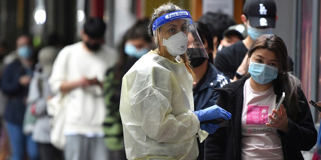 People queue at a walk-in COVID-19 testing site in Melbourne, Australia, Wednesday, Jan. 5, 2022.Â
