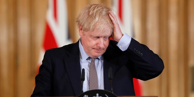 Britain Prime Minister Boris Johnson reacts during a press conference at Downing Street on the government's coronavirus action plan in London March 3, 2020. 