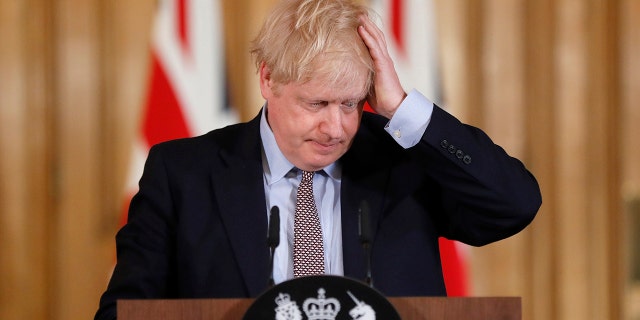 Britain Prime Minister Boris Johnson reacts during a press conference at Downing Street on the government's coronavirus action plan in London March 3, 2020. 