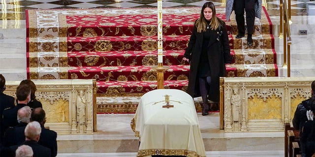 Dominique Rivera walks past her husband's casket after eulogizing him during his funeral mass at St. Patrick's Cathedral on Friday, Jan. 28, 2022. New York City Police Officer Jason Rivera and his partner, Officer Wilbert Mora, were fatally wounded when a gunman ambushed them as they responded to a family dispute last week. "You made me feel alive," his wife said during her heart-wrenching eulogy. "You <i>make</i> me feel alive."