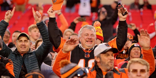 Fans celebrate following the Cincinnati Bengals overtime win against the Kansas City Chiefs in the AFC Championship Game at Arrowhead Stadium. (Photo by David Eulitt/Getty Images)