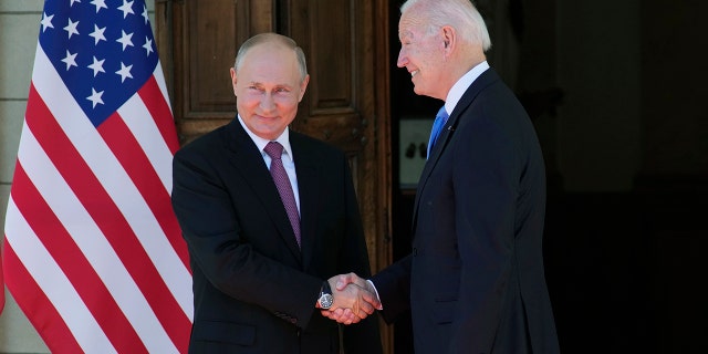Russian President Vladimir Putin and President Joe Biden shake hands during their meeting in Geneva, Switzerland, June 16, 2021.
