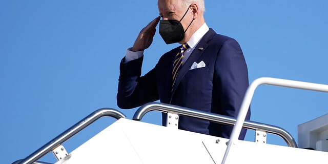 President Joe Biden salutes as he boards Air Force One, Tuesday, Jan. 11, 2022, at Andrews Air Force Base, Md. AP Photo/Patrick Semansky.