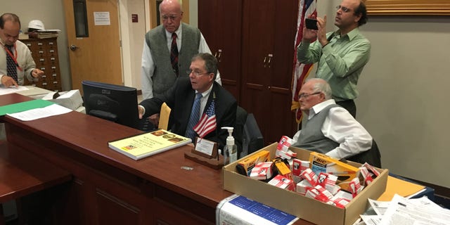 New Hampshire Secretary of State Bill Gardner and deputy Secretary of State Dave Scanlan inspect ballots during an election recount, in Concord, New Hampshire in Nov. 2018.