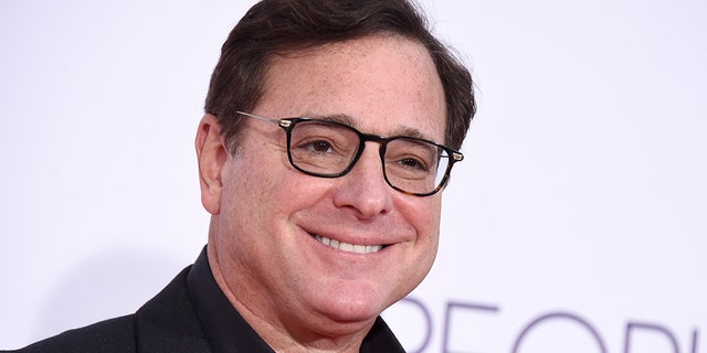Bob Saget arrives at the People's Choice Awards at the Microsoft Theater Jan. 18, 2017, in Los Angeles. Saget, a comedian and actor known for his role as a widower raising a trio of daughters in the sitcom "Full House," died last month at the age of 65. 