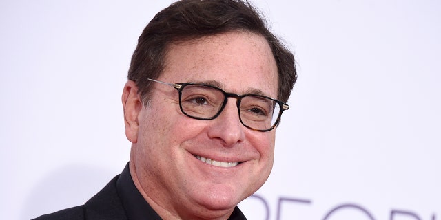 Bob Saget arrives at the People's Choice Awards at the Microsoft Theater Jan. 18, 2017, in Los Angeles. Saget, a comedian and actor known for his role as a widower raising a trio of daughters in the sitcom "Full House," died last month at the age of 65.