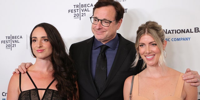 Bob Saget with his daughter Lara (left) an wife Kelly Rizzo. The ‘Full House’ star is survived by Rizzo and three daughters from a previous marriage.