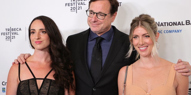 Bob Saget with his daughter Lara (left) an wife Kelly Rizzo. The ‘Full House’ star is survived by Rizzo and three daughters from a previous marriage.