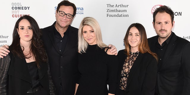 Bob Saget, Kelly Rizzo pose for a photo with Aubrey Saget, Lara Saget and guest as they attend Scleroderma Research Foundation's Cool Comedy - Hot Cuisine New York 2018 in New York City. 