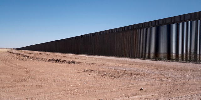 The border wall stretches along the U.S.-Mexico border on the Johnson Ranch near Columbus, New Mexico, on Monday, April 12, 2021. 