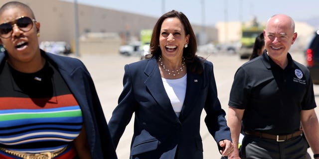 Vice President Kamala Harris walks with Department of Homeland Security Secretary Alejandro Mayorkas and Spokesperson Symone Sanders to board Air Force Two at El Paso International Airport in El Paso, Texas, June 25, 2021.