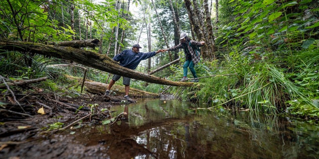 A conservation group is turning over a historic redwood grove on the Northern California coast to the descendants of the original Native American inhabitants.