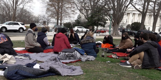 Group of hunger strikers sit on sleeping bags outside the U.S. Capitol Building on the second day of their strike.