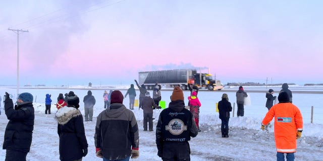 Family, friends and neighbors gather to show support for the freedom convoy on the Trans-Canada highway in Grenfell, Saskatchewan, Canada, Jan. 25, 2022, in this screenshot obtained from a video on social media.