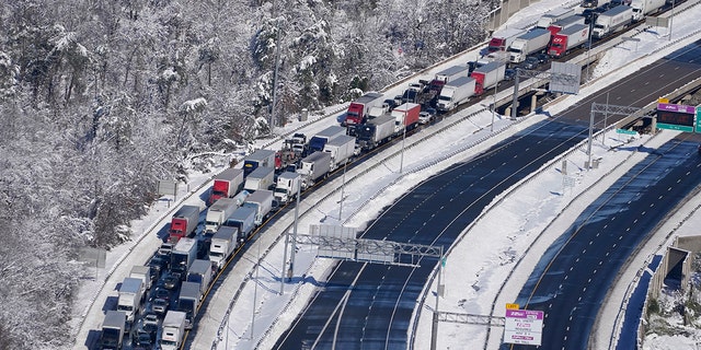 Cars and trucks are stranded on sections of Interstate 95, Jan. 4, 2022, near Quantico, Virginia.