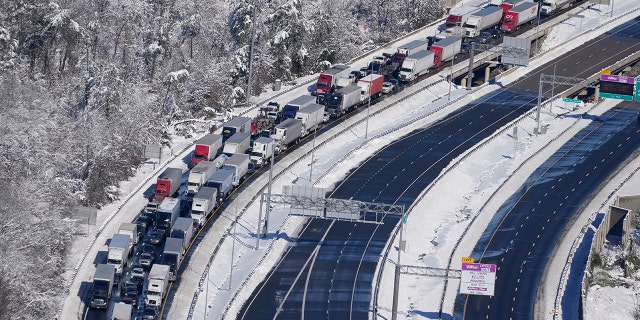 Cars and trucks are stranded on sections of Interstate 95, Jan. 4, 2022, near Quantico, Virginia.