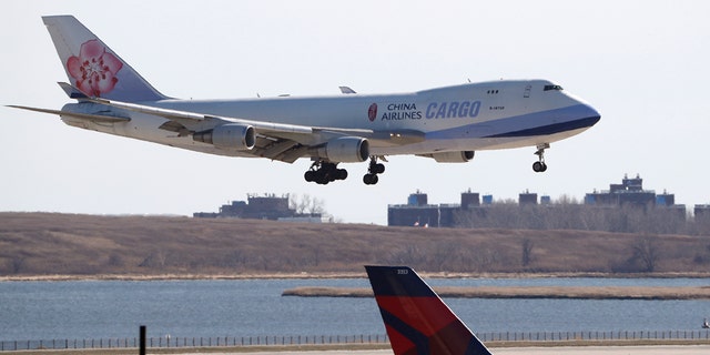  A China Airlines cargo jet lands at John F. Kennedy International Airport, Saturday, March 14, 2020, in New York. Verizon and AT&amp;T have rejected a request by the U.S. government to delay the rollout of next-generation wireless technology. 