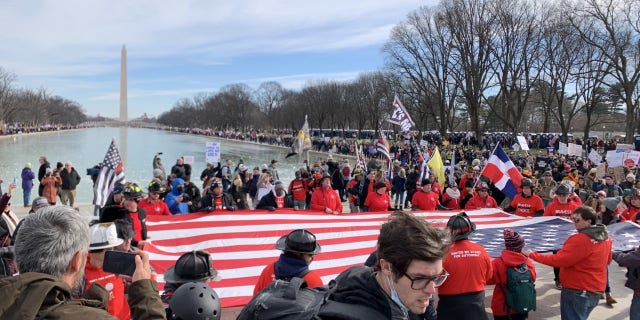 "Defeat the Mandates" march attendees gather in front of the Lincoln Memorial.