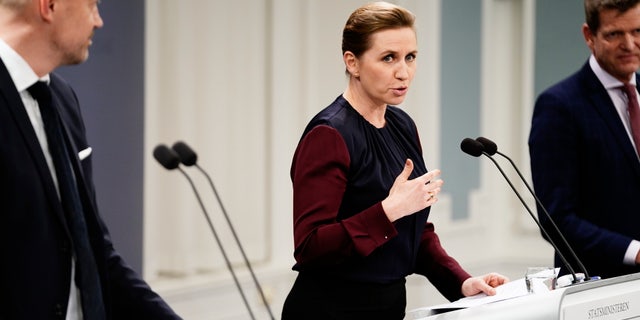Denmark's Prime Minister Mette Frederiksen, takes part in a coronavirus press conference, with Minister of Health Magnus Heunicke and director of the National Board of Health Soeren Brostroem. (AP)