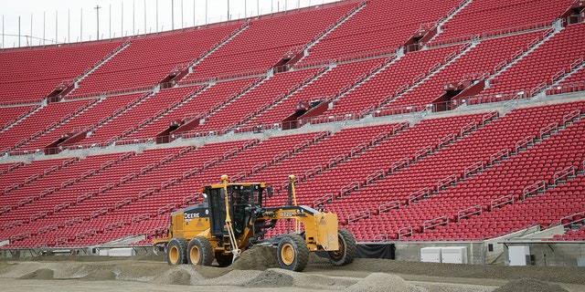 500 truckloads of dirt were required to cover the field.