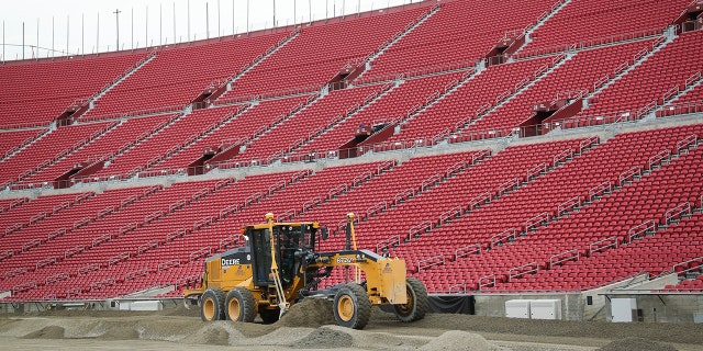 500 truckloads of dirt were required to cover the field.