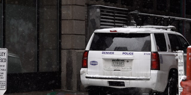 Denver Police car sits in an alley near 16 St Mall