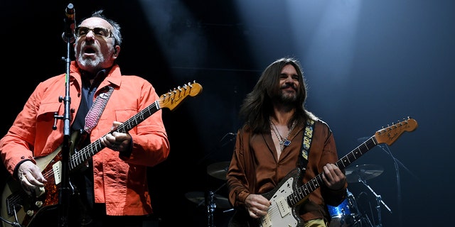 Elvis Costello, left, performs with Juanes in Inglewood, California, Oct. 2, 2021.