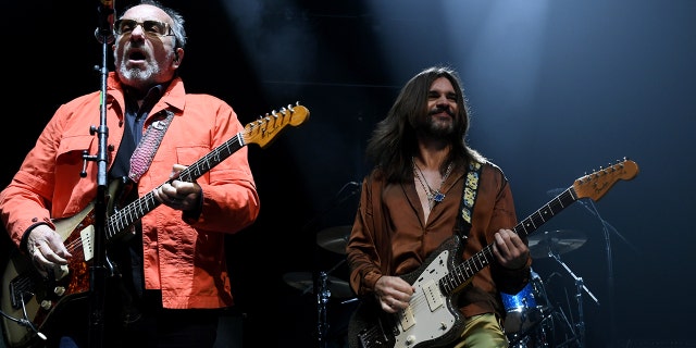 Elvis Costello, left, performs with Juanes in Inglewood, California, Oct. 2, 2021.