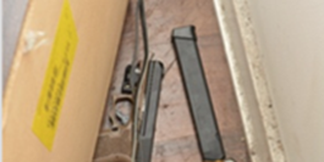 A firearm with an extended magazine was recovered in a nearby residence. 