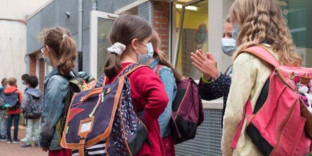 Students attend the first day of school for the 2021-2022 year at Gounod Lavoisier Primary school, Lille, northern France, Thursday, Sept. 2, 2021.