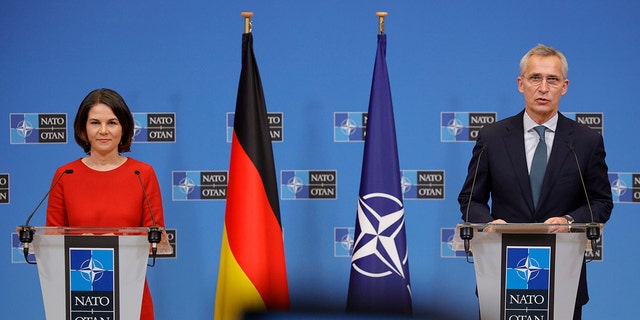German Foreign Minister Annalena Baerbock and NATO Secretary General Jens Stoltenberg speak during a press conference in Brussels, Belgium, Thursday, Dec. 9, 2021. 