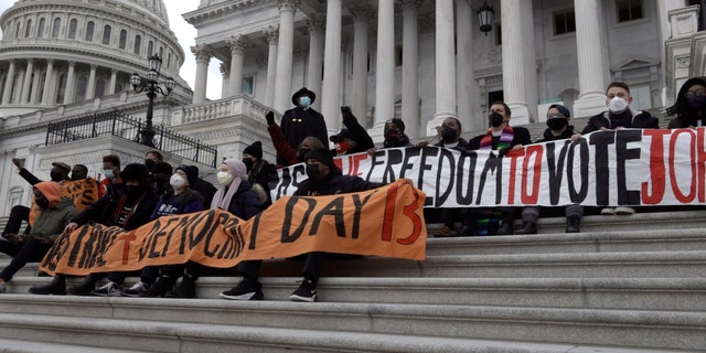 Hunger strikers chant and sing on U.S. Capitol steps