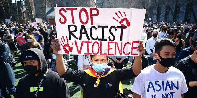 Members and supporters of the Asian-American community attend a "rally against hate" at Columbus Park in New York City on March 21, 2021.