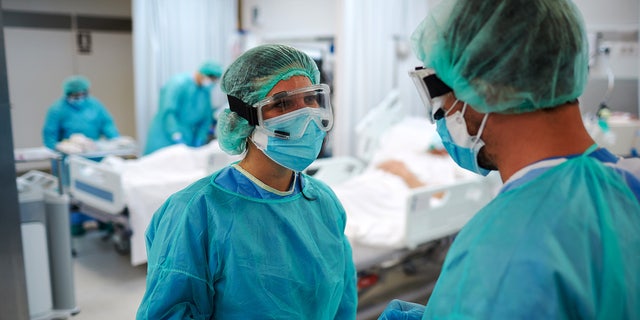 Two healthcare workers talking at the UCI