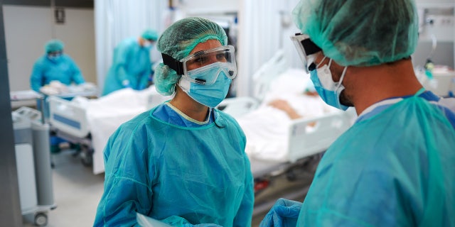 Two healthcare workers talking at the UCI