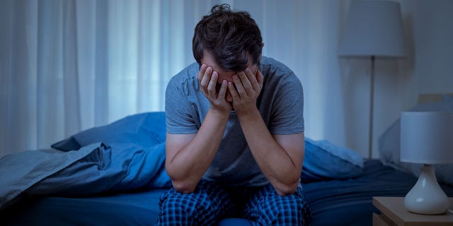 A depressed man at a lonely and useless night.  The COVID-19 pandemic worsened certain mental health conditions, increasing depression and anxiety by more than 25% in the first year alone. 