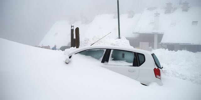 If your car gets plowed in, avoid running the engine to prevent suffocating on the fumes due to a clogged tailpipe, say safety experts.